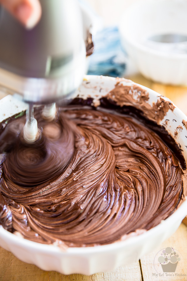 Beat the melted chocolate in - part of step by step instructions to make the most delicious Chocolate Fudge Frosting
