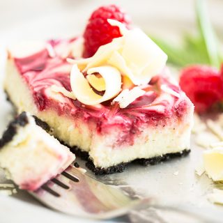 An irresistibly delicious combination of sweet Oreo cookie crust, creamy white chocolate cheesecake and a beautiful swirl of raspberry puree.