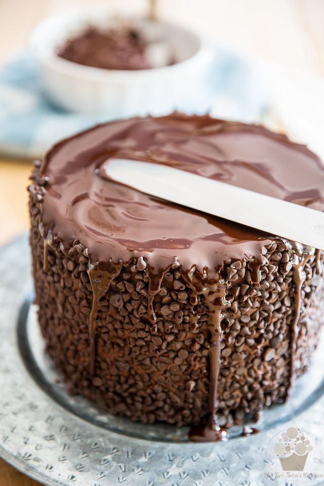 Pouring the ganache over the cake - part of My Evil Twin's Kitchen's Wicked Windmill Chocolate Cake step-by-step instructions