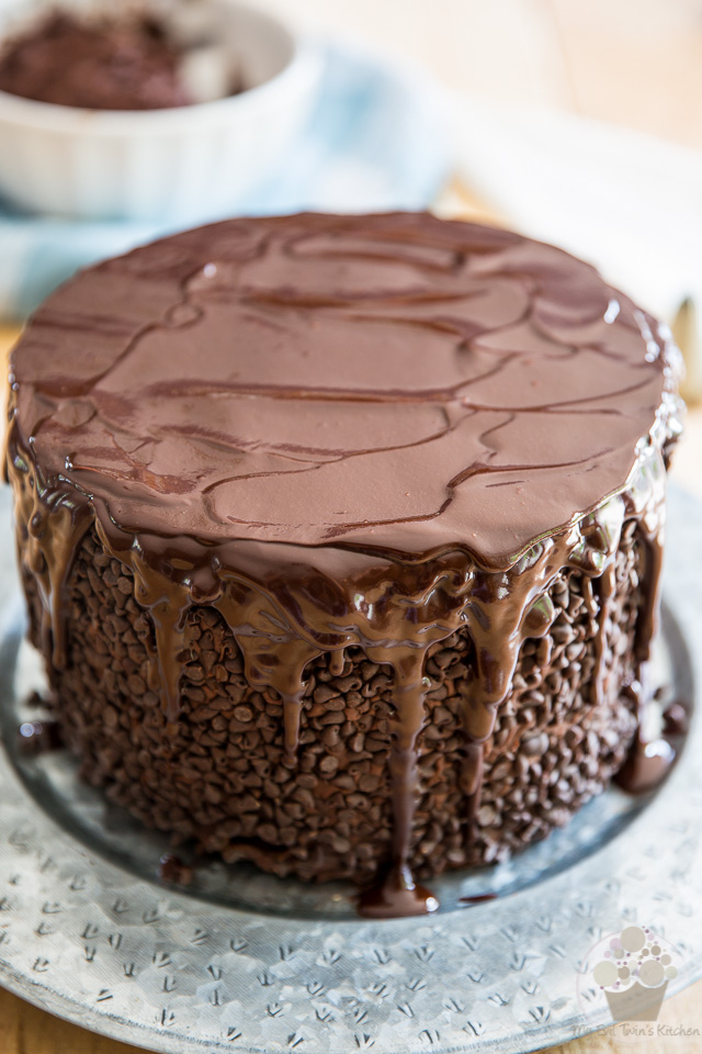 Pouring the ganache over the cake - part of My Evil Twin's Kitchen's Wicked Windmill Chocolate Cake step-by-step instructions