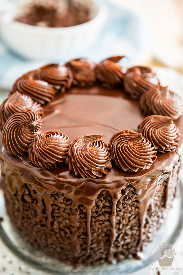 Piping rosettes on top of the cake - part of My Evil Twin's Kitchen's Wicked Windmill Chocolate Cake step-by-step instructions