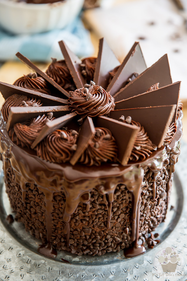 Putting the finishing touches to the cake - part of My Evil Twin's Kitchen's Wicked Windmill Chocolate Cake step-by-step instructions