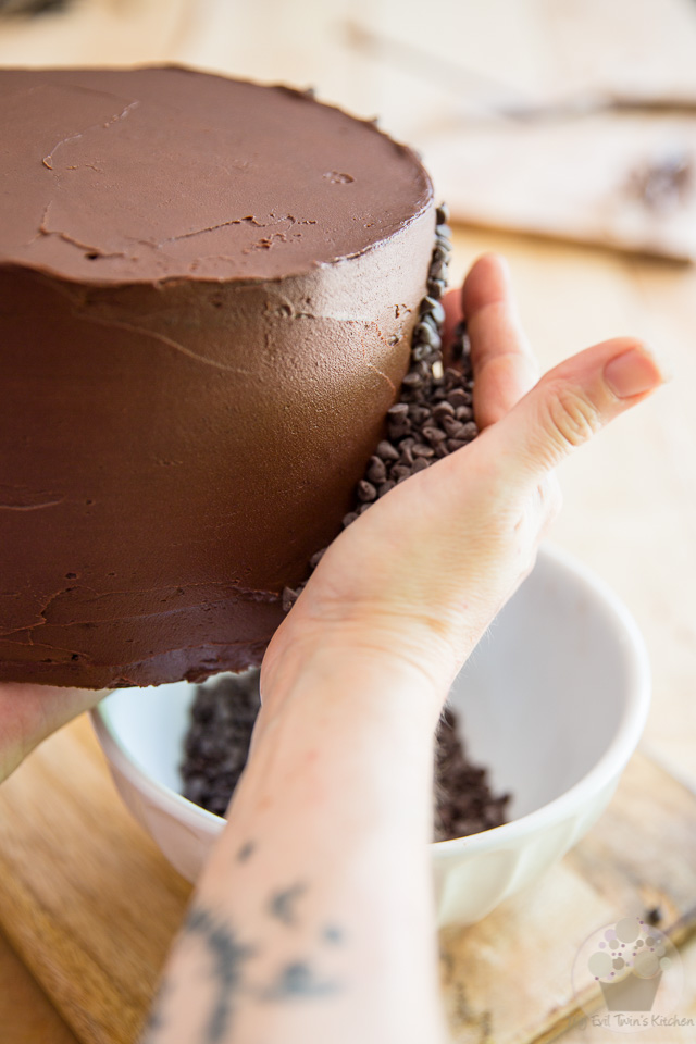 Cover the sides with mini-chocolate chips - part of My Evil Twin's Kitchen's Wicked Windmill Chocolate Cake step-by-step instructions