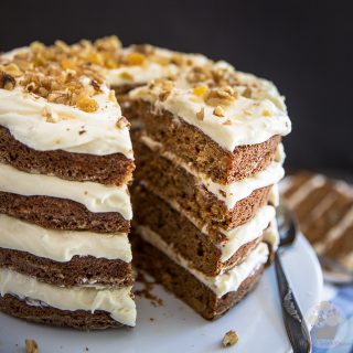 This naked carrot cake is exquisitely sweet and spiced, perfectly moist and tender, with an impeccable tangy cream cheese frosting that's totally insane and dangerously yummy.
