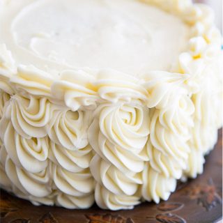 A Pipeable Cream Cheese Frosting sturdy enough to be used for piping perfect swirls onto cakes and cupcakes that tastes so good you'll want to bathe in it!